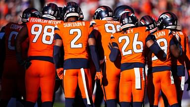 Nov 17, 2024; Denver, Colorado, USA; Members of the Denver Broncos defensive team huddle in the first quarter against the Atlanta Falcons at Empower Field at Mile High.