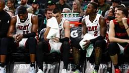 Miami Heat players (left to right) center Bam Adebayo (13), guard Tyler Herro (14), guard Terry Rozier (2) and forward Duncan Robinson (55) sit on the bench during the fourth quarter of their loss to the Boston Celtics at TD Garden.