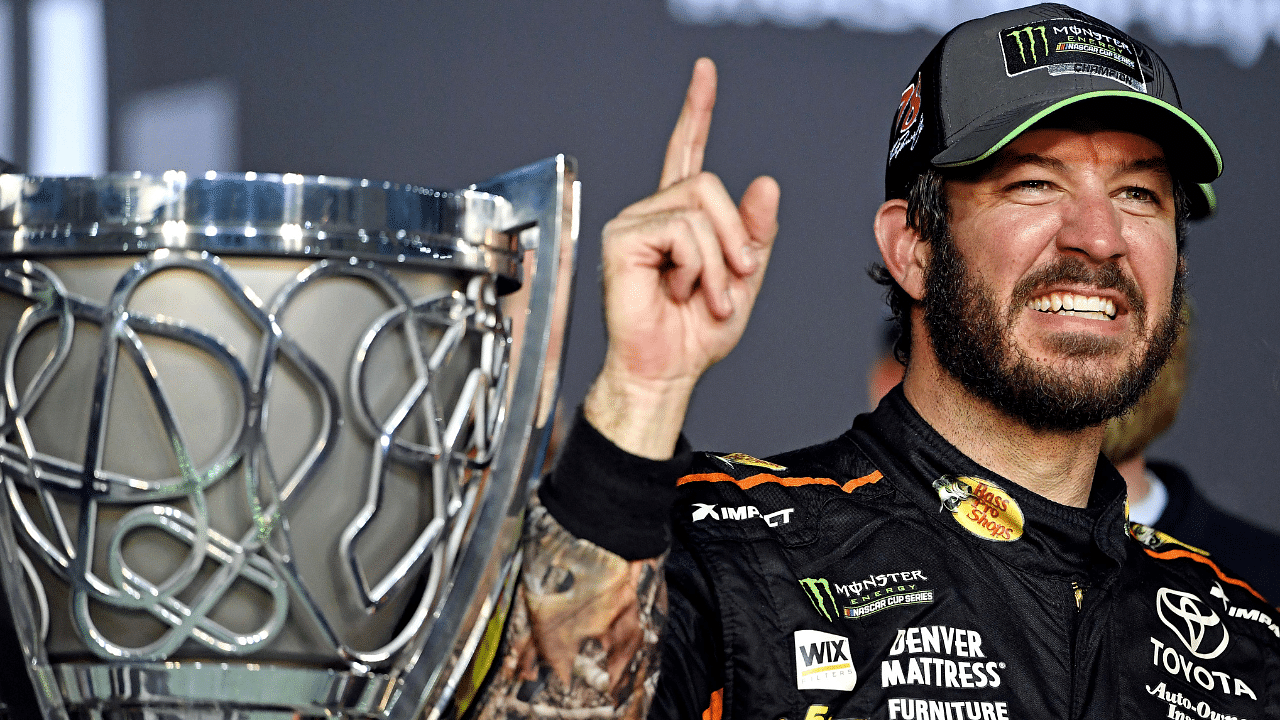 NASCAR Cup Series driver Martin Truex Jr. (78) celebrates winning the NASCAR Cup Championship after the Ford EcoBoost 400 and the NASCAR Cup Championship at Homestead-Miami Speedway.