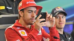 Nov. 15, 2012 - Austin, Texas, USA - Formula 1 driver FERNANDO ALONSO (left) of Spain takes pictures of the media during a press conference at the Circuit of the America s in Austin, Texas