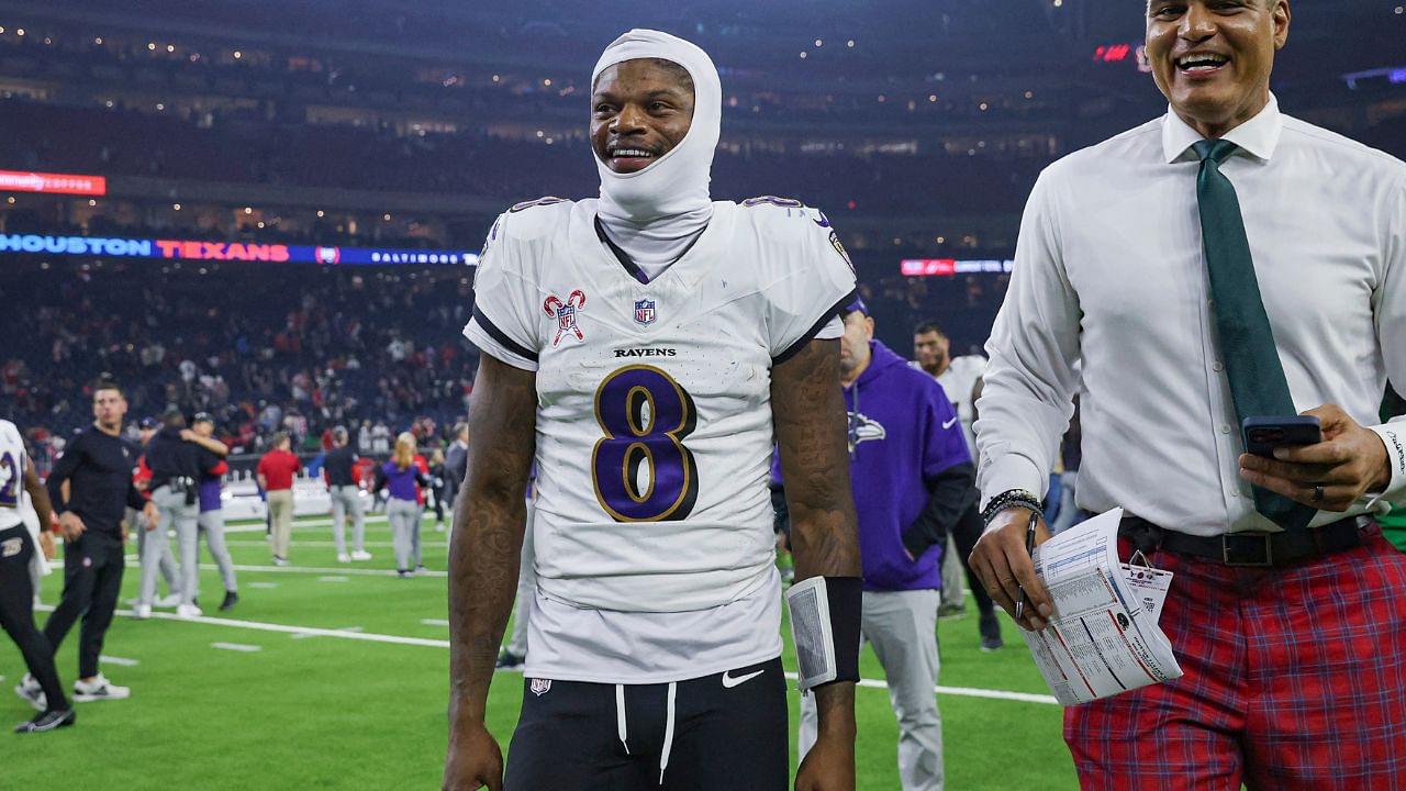 Baltimore Ravens quarterback Lamar Jackson (8) smiles while walking off the field after the game against the Houston Texans at NRG Stadium.