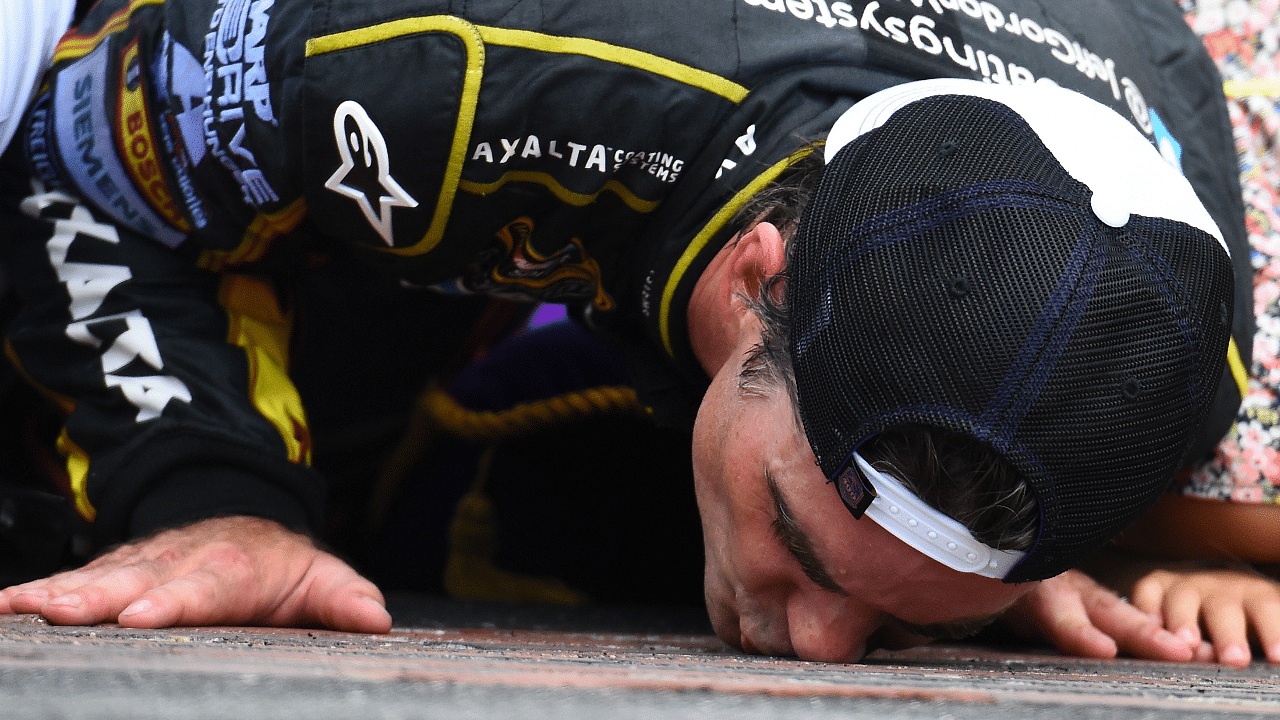 NASCAR Sprint Cup Series driver Jeff Gordon (24) kisses the brick after winning the Crown Royal Brickyard 400 at Indianapolis Motor Speedway.