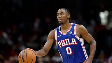 Philadelphia 76ers guard Tyrese Maxey (0) brings the ball up court against the Chicago Bulls during the second half at United Center.