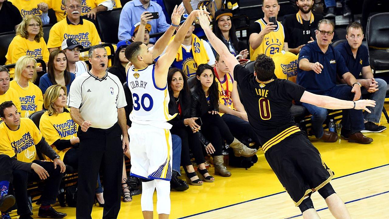 Golden State Warriors guard Stephen Curry (30) shoots the ball against Cleveland Cavaliers forward Kevin Love (0) during the second quarter in game five of the NBA Finals at Oracle Arena.