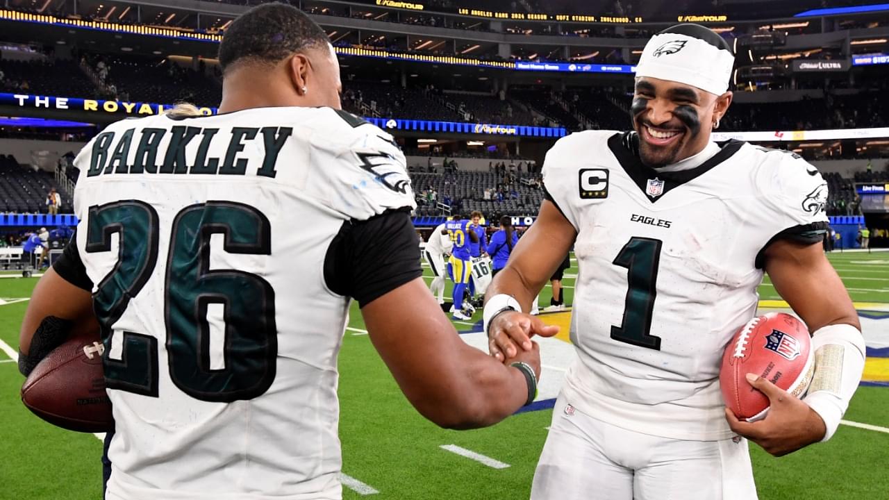 Nov 24, 2024; Inglewood, California, USA; Philadelphia Eagles quarterback Jalen Hurts (1) celebrates with running back Saquon Barkley (26) after the Eagles defeat the Los Angeles Rams during the first half at SoFi Stadium.