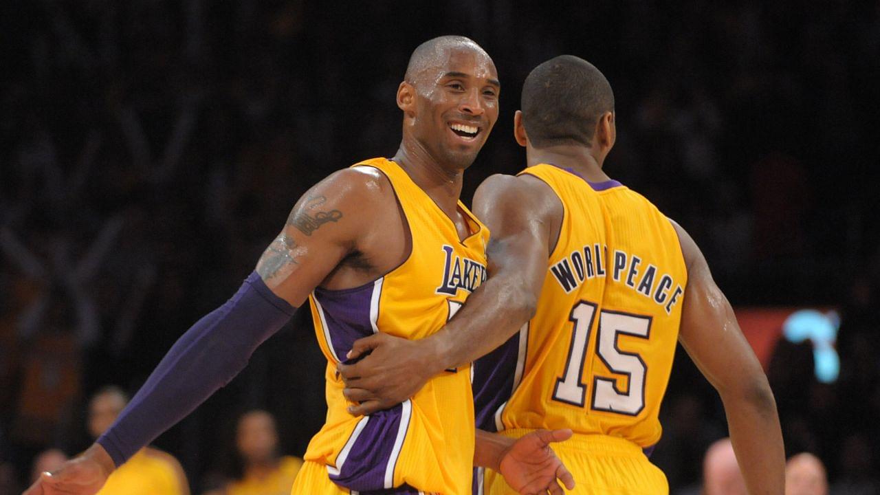 Los Angeles Lakers guard Kobe Bryant (24) and forward Metta World Peace (15) react in the fourth quarter against the Brooklyn Nets at the Staples Center. The Lakers defeated the Nets 95-90