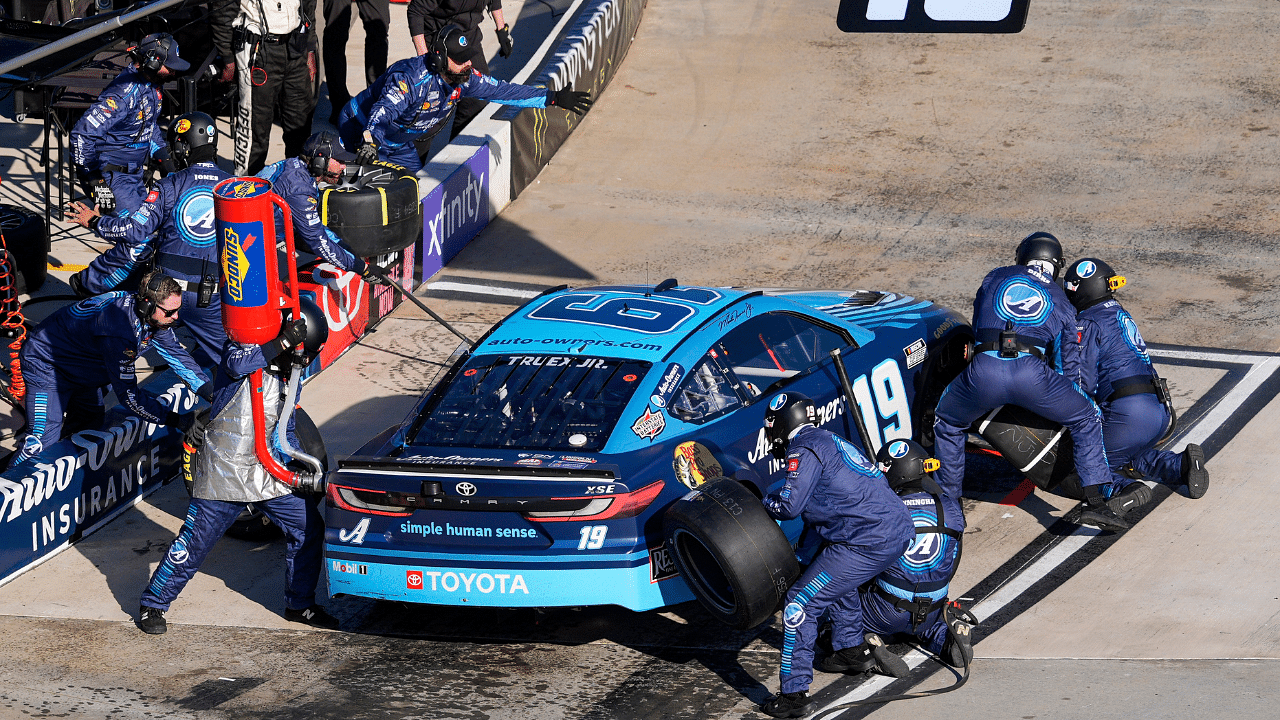 NASCAR Cup Series driver Martin Truex Jr. (19) pit crew go to work during the Xfinity 500 at Martinsville Speedway.