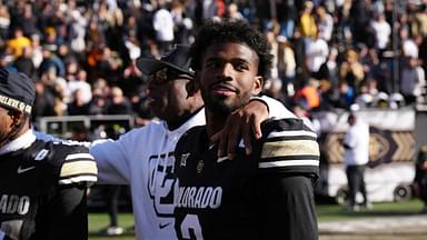 Colorado Buffaloes quarterback Shedeur Sanders (2) and head coach Deion Sanders ifollowing the win over the Oklahoma State Cowboys at Folsom Field.