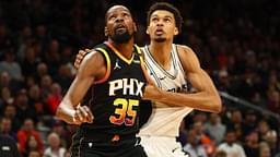 Phoenix Suns forward Kevin Durant (35) against San Antonio Spurs center Victor Wembanyama (1) in the first half of an NBA Cup game at Footprint Center.