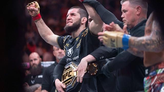 Islam Makhachev (red gloves) celebrates defeating Dustin Poirier (blue gloves) during UFC 302 at Prudential Center.