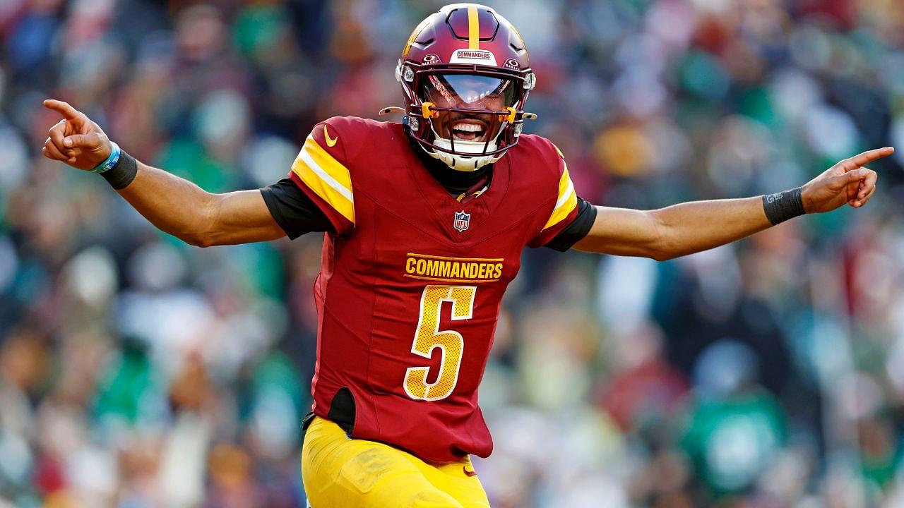 Washington Commanders quarterback Jayden Daniels (5) celebrates after throwing a touchdown during the fourth quarter against the Philadelphia Eagles at Northwest Stadium.