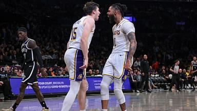 Los Angeles Lakers guard Austin Reaves (15) and guard D'Angelo Russell (1) react after a basket during the second half against the Brooklyn Nets at Barclays Center