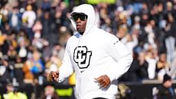 Colorado Buffaloes head coach Deion Sanders runs onto the field before the game against the Oklahoma State Cowboys at Folsom Field.