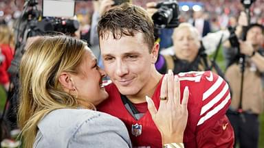 San Francisco 49ers quarterback Brock Purdy (13) kisses his fiance Jenna Brandt after winning the NFC Championship football game against the Detroit Lions at Levi's Stadium