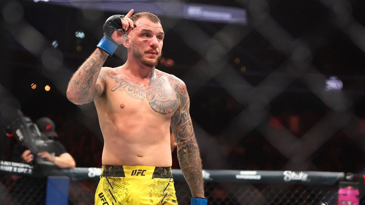 Renato Moicano (blue gloves) reacts after defeating Jalin Turner (not pictured) during UFC 300 at T-Mobile Arena.