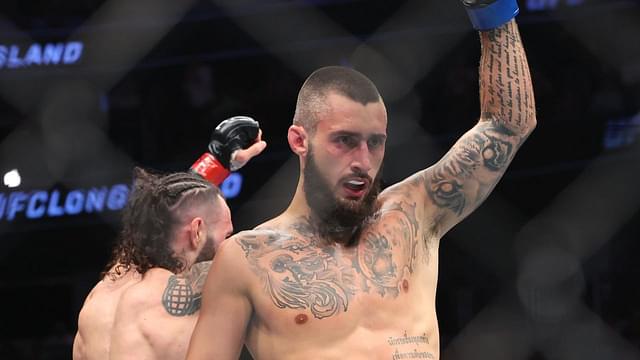 Charles Jourdain (blue gloves) reacts after fight against Shane Burgos (red gloves) during UFC Fight Night at UBS Arena.