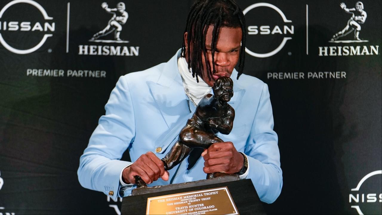 Colorado Buffaloes wide receiver/cornerback Travis Hunter poses for a photo after winning the Heisman Trophy award during the 2024 Heisman Trophy Presentation.