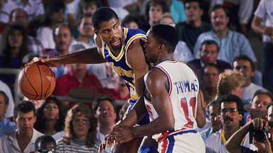 Los Angeles Lakers guard Magic Johnson (32) is defended by Detroit Pistons guard Isiah Thomas (11) at the Silverdome.