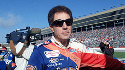 Darrell Waltrip munches on an energy bar before the start of his final NASCAR race after 28 years of racing. The race is the NAPA 500 at the Atlanta Motor Speedway Nov. 20, 2000.