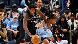 Brooklyn Nets forward Dorian Finney-Smith (28) and Memphis Grizzlies guard Ja Morant (12) battle for a loose ball during the first quarter at FedExForum.