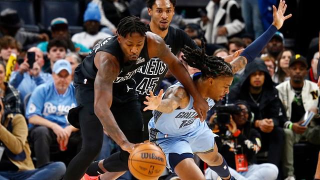 Brooklyn Nets forward Dorian Finney-Smith (28) and Memphis Grizzlies guard Ja Morant (12) battle for a loose ball during the first quarter at FedExForum.