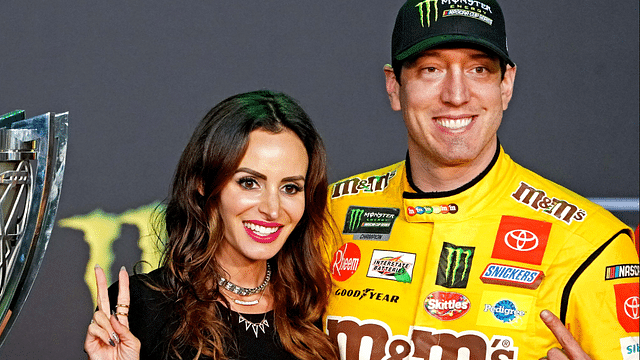 NASCAR Cup Series driver Kyle Busch (18) celebrates after winning the NASCAR Series Cup Championship with his wife Samantha Busch after the Ford EcoBoost 400 at Homestead-Miami Speedway.