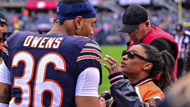 Chicago Bears defensive back Jonathan Owens (36) is greeted by wife and United States gymnast Simone Biles before the game against the Green Bay Packers at Soldier Field.