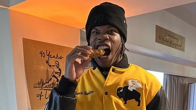 Travis Hunter with a chicken wing.