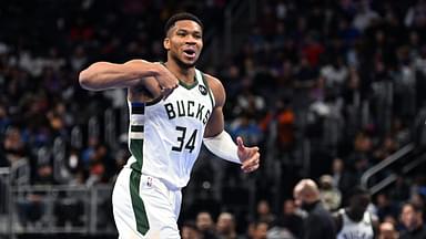 Milwaukee Bucks forward Giannis Antetokounmpo (34) reacts after making a three-point shot against the Detroit Pistons in the third quarter at Little Caesars Arena.