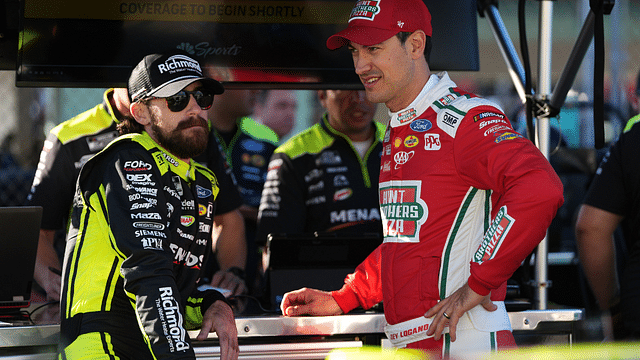 NASCAR Cup Series driver Ryan Blaney (L) talks with NASCAR Cup Series driver Joey Logano (R) during practice for the Straight Talk Wireless 400 at Homestead-Miami Speedway.