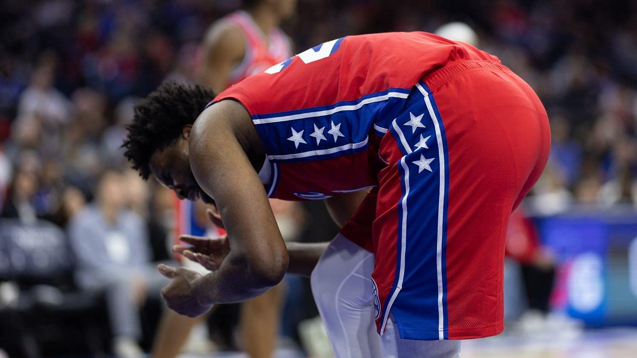 Philadelphia 76ers center Joel Embiid (21) grabs his face after a collision during the second quarter at Wells Fargo Center.