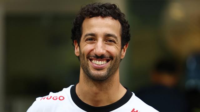 F1 Grand Prix Of Singapore - Previews Daniel Ricciardo of Australia and Visa Cash App RB F1 Team poses with fans during previews ahead of the F1 Grand Prix of Singapore