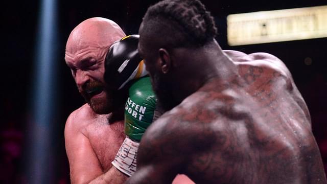 Deontay Wilder (red/black trunks) and Tyson Fury (black/gold trunks) box during their WBC/Lineal heavyweight championship boxing match at T-Mobile Arena.