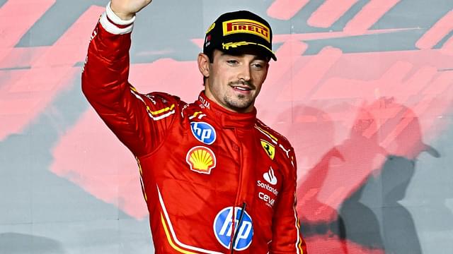 Second place winner Monaco's Formula One driver Charles Leclerc of Ferrari celebrates on the podium after after the Formula 1 Grand Prix of Qatar