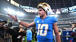 Los Angeles Chargers quarterback Justin Herbert (10) celebrates as he leaves the field after defeating the Denver Broncos at SoFi Stadium.