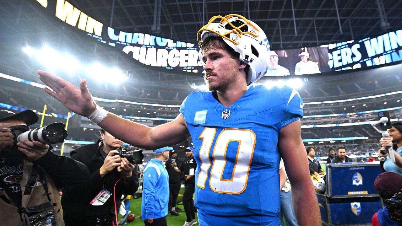 Los Angeles Chargers quarterback Justin Herbert (10) celebrates as he leaves the field after defeating the Denver Broncos at SoFi Stadium.