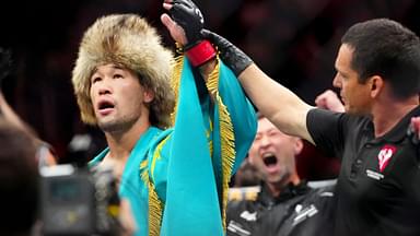 Shavkat Rakhmonov (red gloves) reacts after defeating Stephen Thompson (blue gloves) during UFC 296 at T-Mobile Arena.