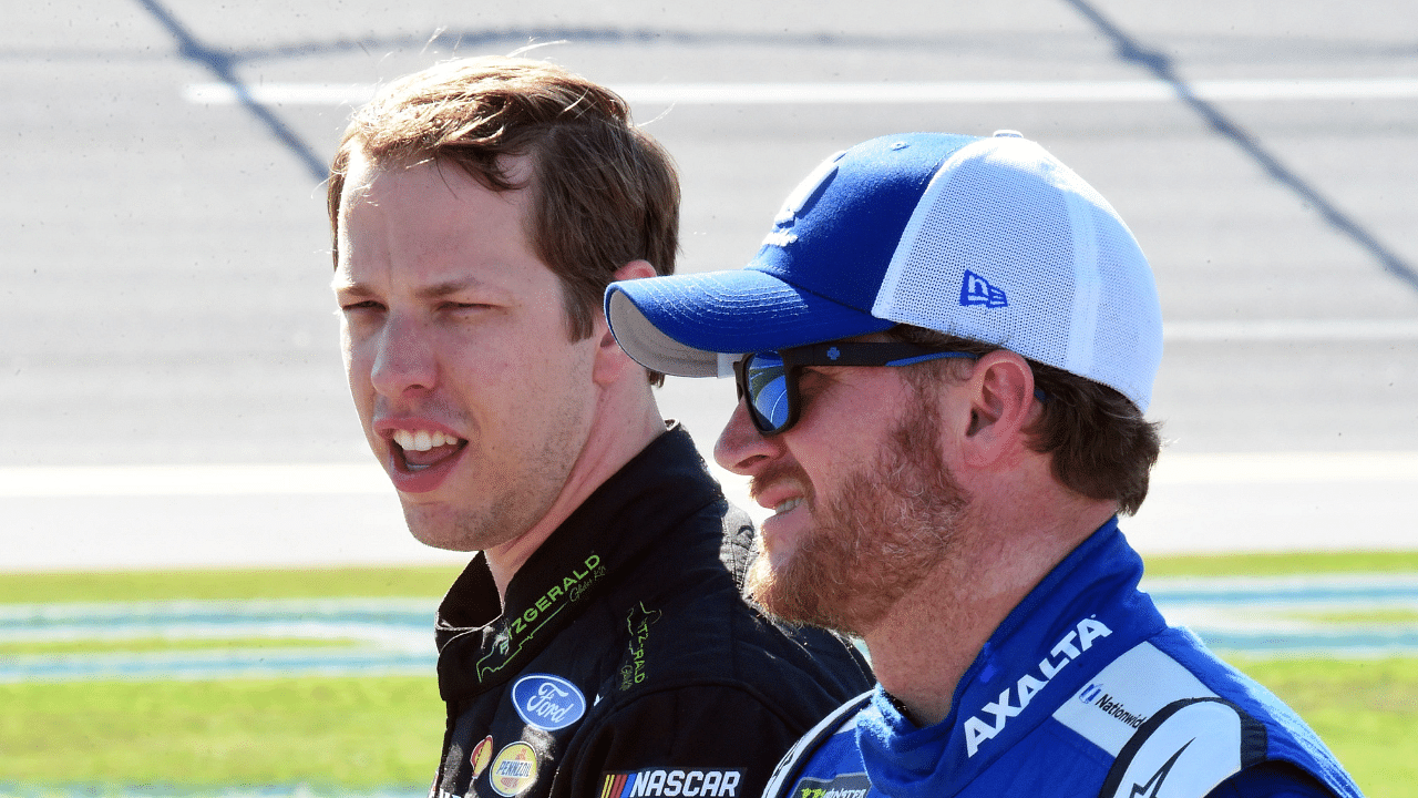 NASCAR Cup Series driver Brad Keselowski (2) talks with Dale Earnhardt Jr. (88) during qualifying for the GEICO 500 at Talladega Superspeedway.