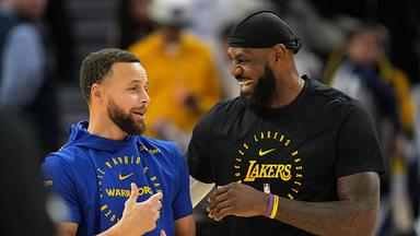 Golden State Warriors guard Stephen Curry (left) and Los Angeles Lakers forward LeBron James (right) talk before the game at Chase Center.