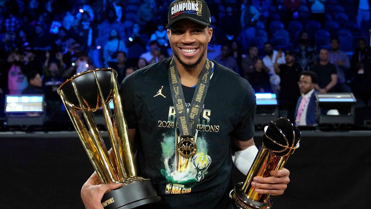 Milwaukee Bucks forward Giannis Antetokounmpo (34) celebrates with the most valuable player and championship trophies after winning the Emirates NBA Cup championship game against the Oklahoma City Thunder at T-Mobile Arena.