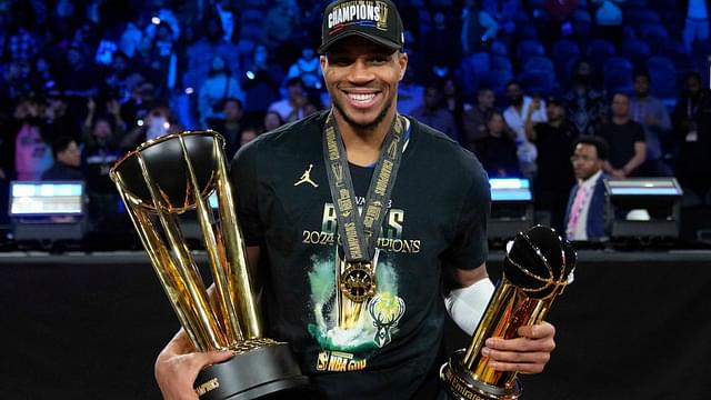 Milwaukee Bucks forward Giannis Antetokounmpo (34) celebrates with the most valuable player and championship trophies after winning the Emirates NBA Cup championship game against the Oklahoma City Thunder at T-Mobile Arena.