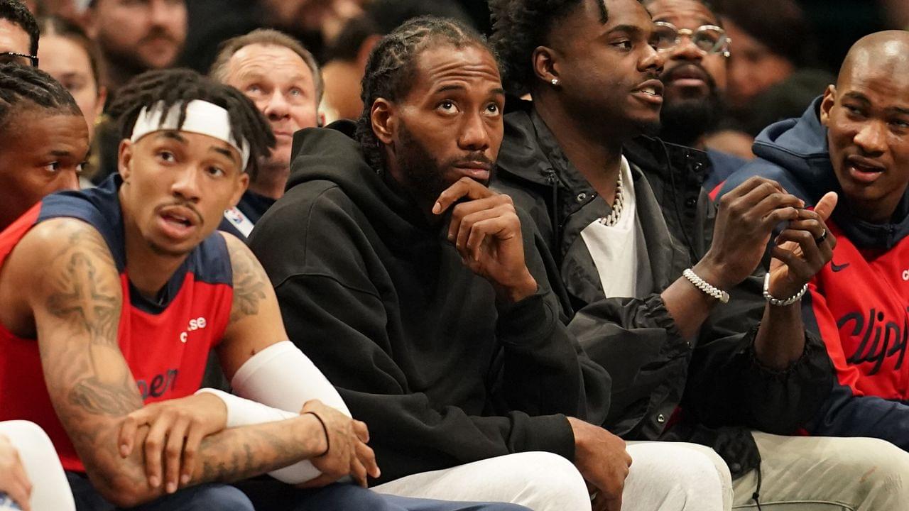 Kawhi Leonard looks on from the bench in street clothes during the game against the Dallas Mavericks during the second half at American Airlines Center.