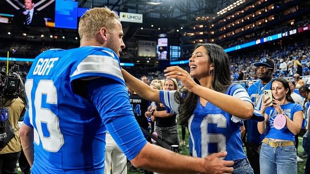 Detroit Lions quarterback Jared Goff hugs his wife Christen Harper during warmups before the Los Angeles Rams game at Ford Field in Detroit on Sunday, Sept. 8, 2024.