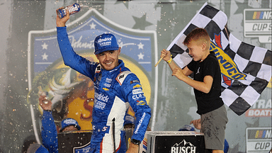 NASCAR Cup Series driver Kyle Larson (5) and his son Owen after winning the Bass Pro Shops Night Race at Bristol Motor Speedway.