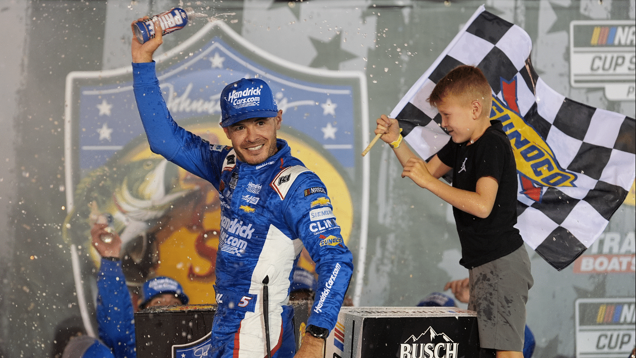 NASCAR Cup Series driver Kyle Larson (5) and his son Owen after winning the Bass Pro Shops Night Race at Bristol Motor Speedway.