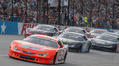 Racers make their way around the track during the start of the 56th Annual Snowball Derby at Five Flags Speedway Sunday, December 3, 2023.