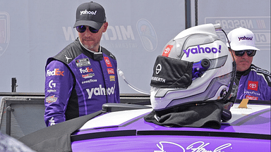 Denny Hamlin prepare to get in his car during Sunday's pre-race for the NASCAR Cup Series FireKeepers Casino 400 at Michigan International Speedway.