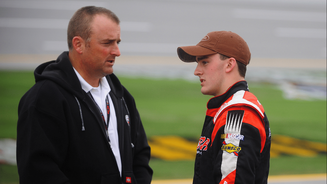 NASCAR Camping World Truck Series driver Austin Dillon (right) talks with father Mike Dillon during qualifying for the Mountain Dew 250 at the Talladega Superspeedway.