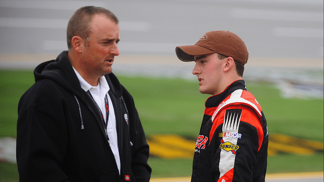 NASCAR Camping World Truck Series driver Austin Dillon (right) talks with father Mike Dillon during qualifying for the Mountain Dew 250 at the Talladega Superspeedway.