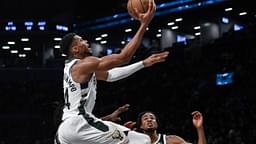 Milwaukee Bucks forward Giannis Antetokounmpo (34) drives to the basket while being defended by Brooklyn Nets forward Dorian Finney-Smith (28) and Brooklyn Nets center Nic Claxton (33) during the second half at Barclays Center.